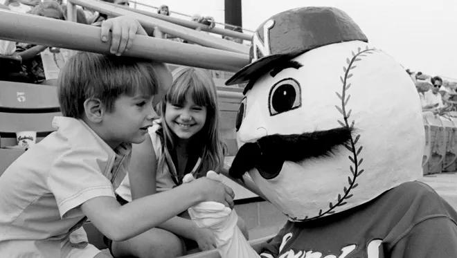 The Nashville Sounds mascot greets a couple of kids in the stands of Greer Stadium before the start of the Sounds game with Montgomery Rebels July 29, 1978.